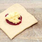 Pastry Cream Filled Buns for Mardi Gras Pastry Cream Filled Buns with raspberry jam